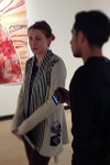 Artist Courtney Heiser stands in the Gatov Gallery at the CSULB School of Art and discusses her work with students visiting the gallery.