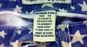 photo of denim cutoffs with a USA flag pattern and a "Made in China" label