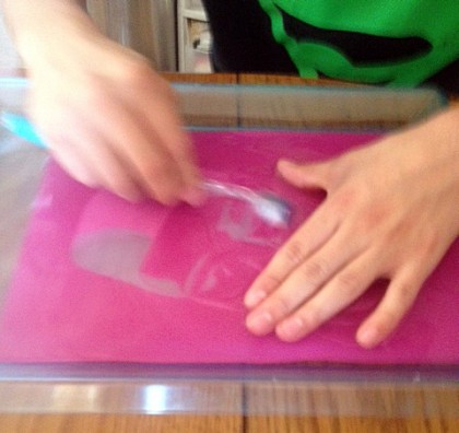 Steven Lozano preparing a silkscreen stencil