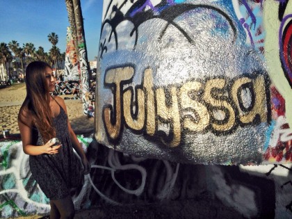 Julyssa Juarez at the Venice Beach Legal Art Walls in Venice Beach, California, writing her name "Julyssa" in Bubble Letters