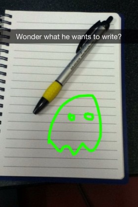 snapchat screen cap showing a blank notepad with a green ghost drawn on the snapchat layer and the superimposed caption "wonder what he wants to draw?"