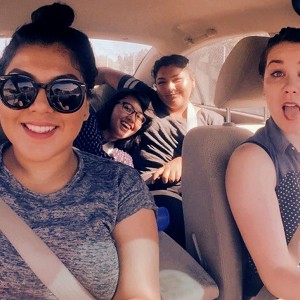 Photo of Stephanie Mejia, Diana Martinez, Anna Joy Floresca, C-Dawg & Allison Wendell riding in a car on their way to a Graffiti Writing Activity at the Venice Beach Legal Art Walls
