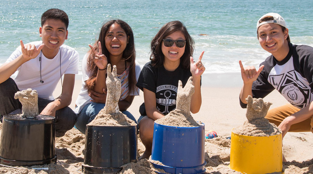 4 CSULB Students show off their plaster cast sculpltures